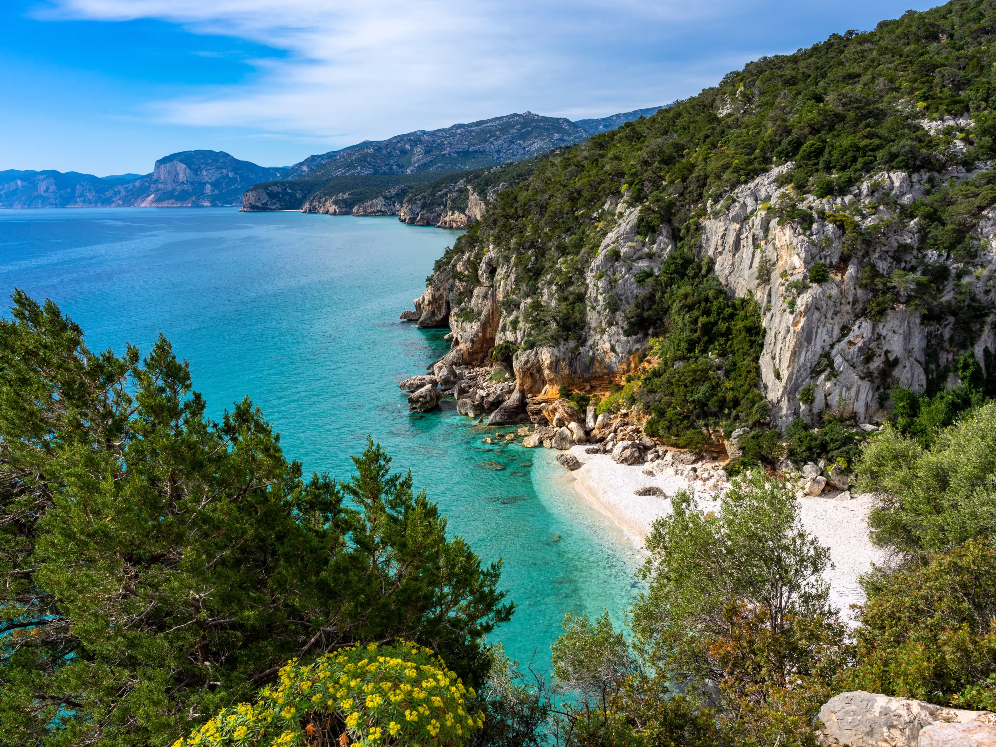 Individual vacation in Sardinia, Italy: Hike at the beautiful bay, Spiaggia di Cala Fuili on the east coast at the Golfo di Orosei. Near Gennargentu National Park and Porto di Cala Gonone