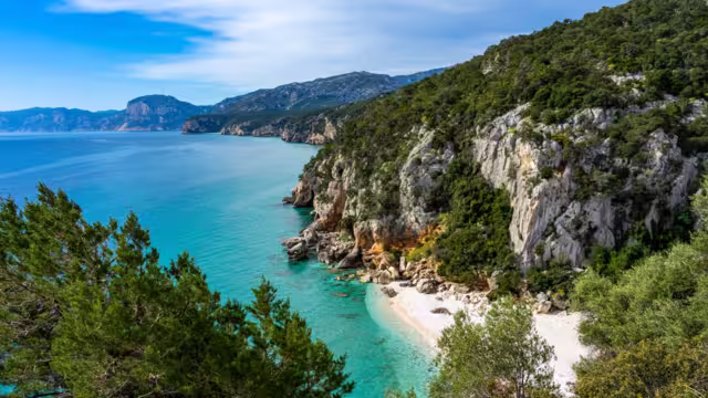 Individual vacation in Sardinia, Italy: Hike at the beautiful bay, Spiaggia di Cala Fuili on the east coast at the Golfo di Orosei. Near Gennargentu National Park and Porto di Cala Gonone