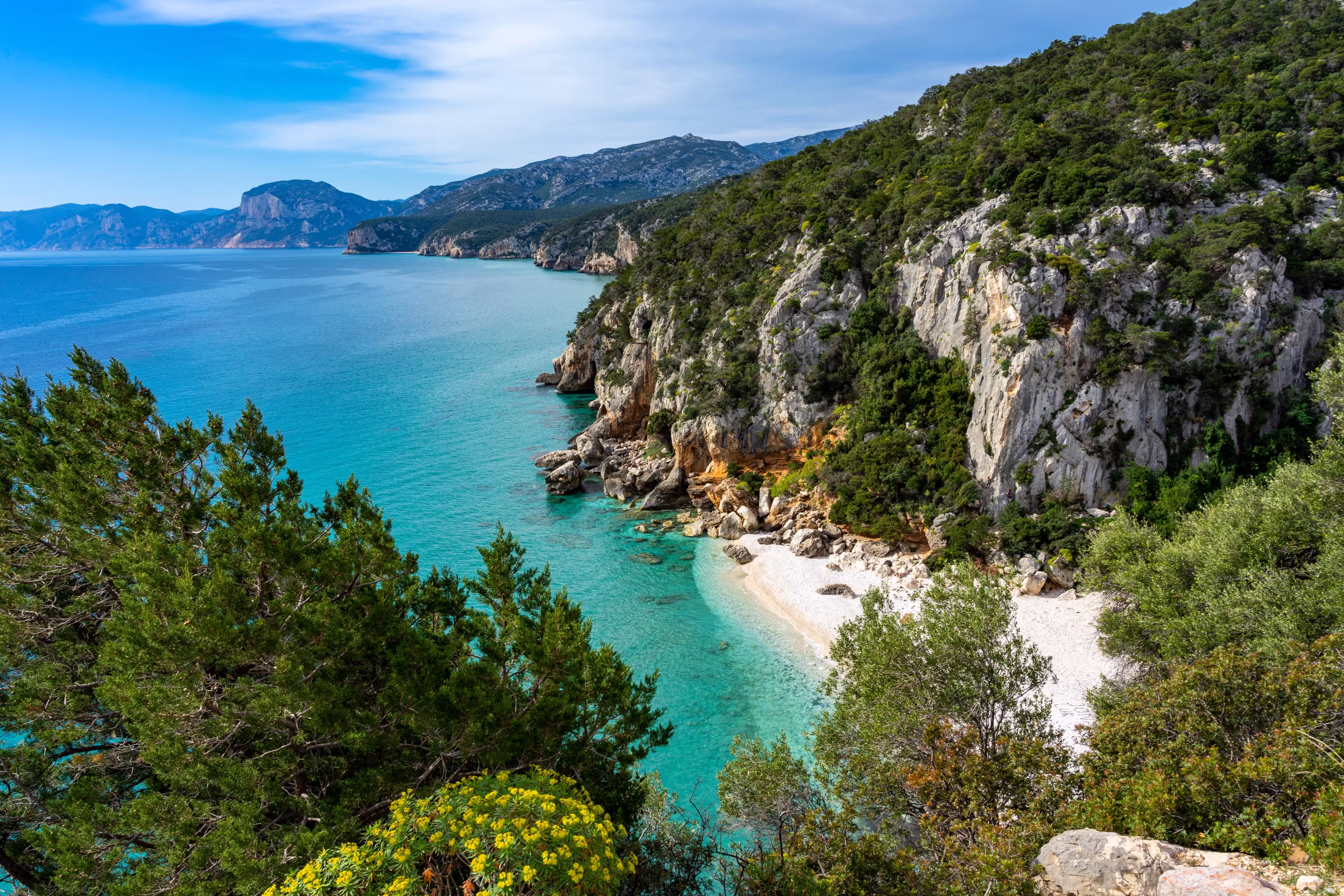 Individual vacation in Sardinia, Italy: Hike at the beautiful bay, Spiaggia di Cala Fuili on the east coast at the Golfo di Orosei. Near Gennargentu National Park and Porto di Cala Gonone