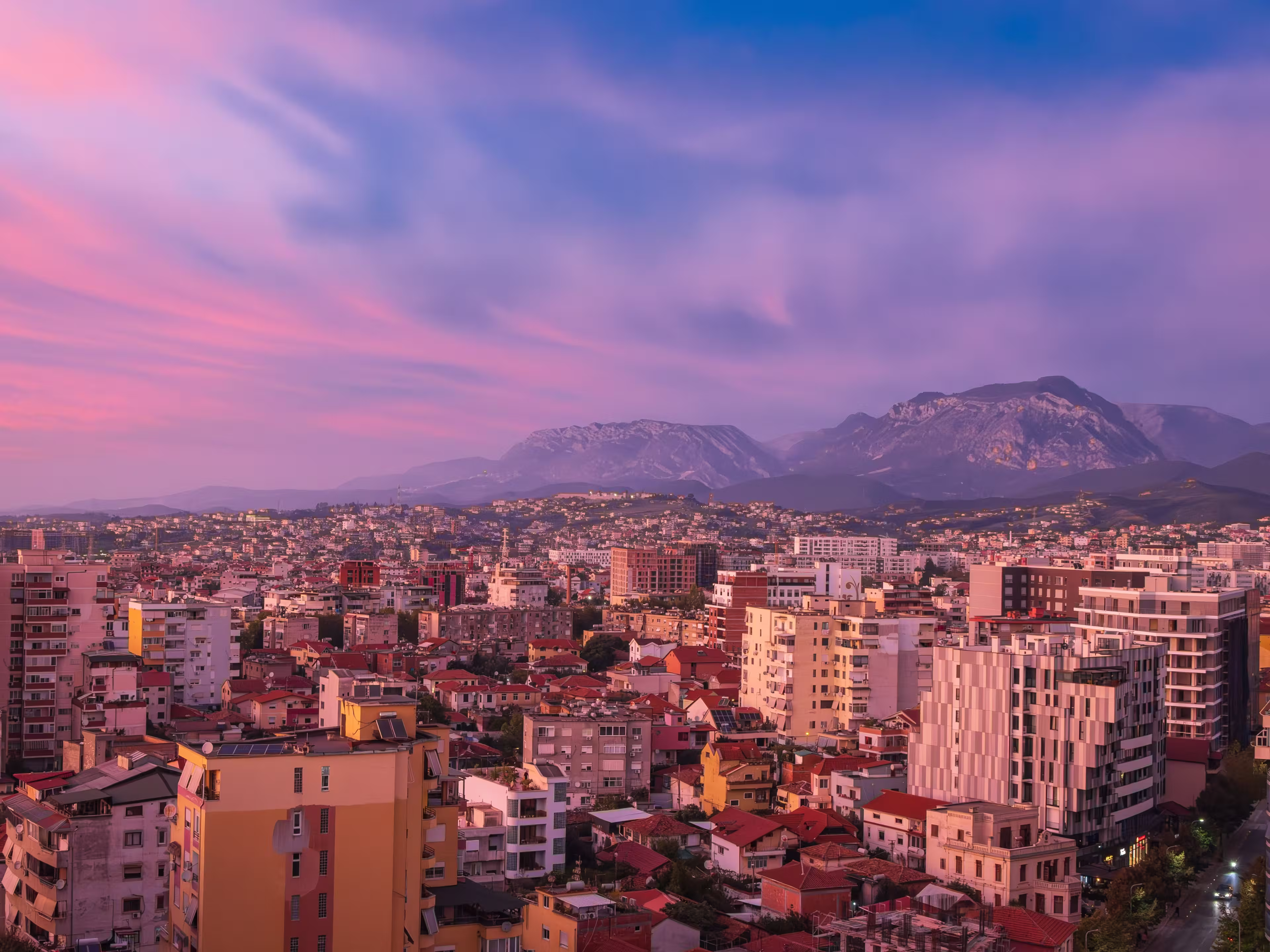 Tirana, Albania. Modern cityscape of downtown Tirana in pink sunset light.