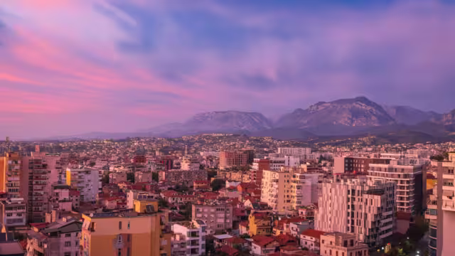 Tirana, Albania. Modern cityscape of downtown Tirana in pink sunset light.