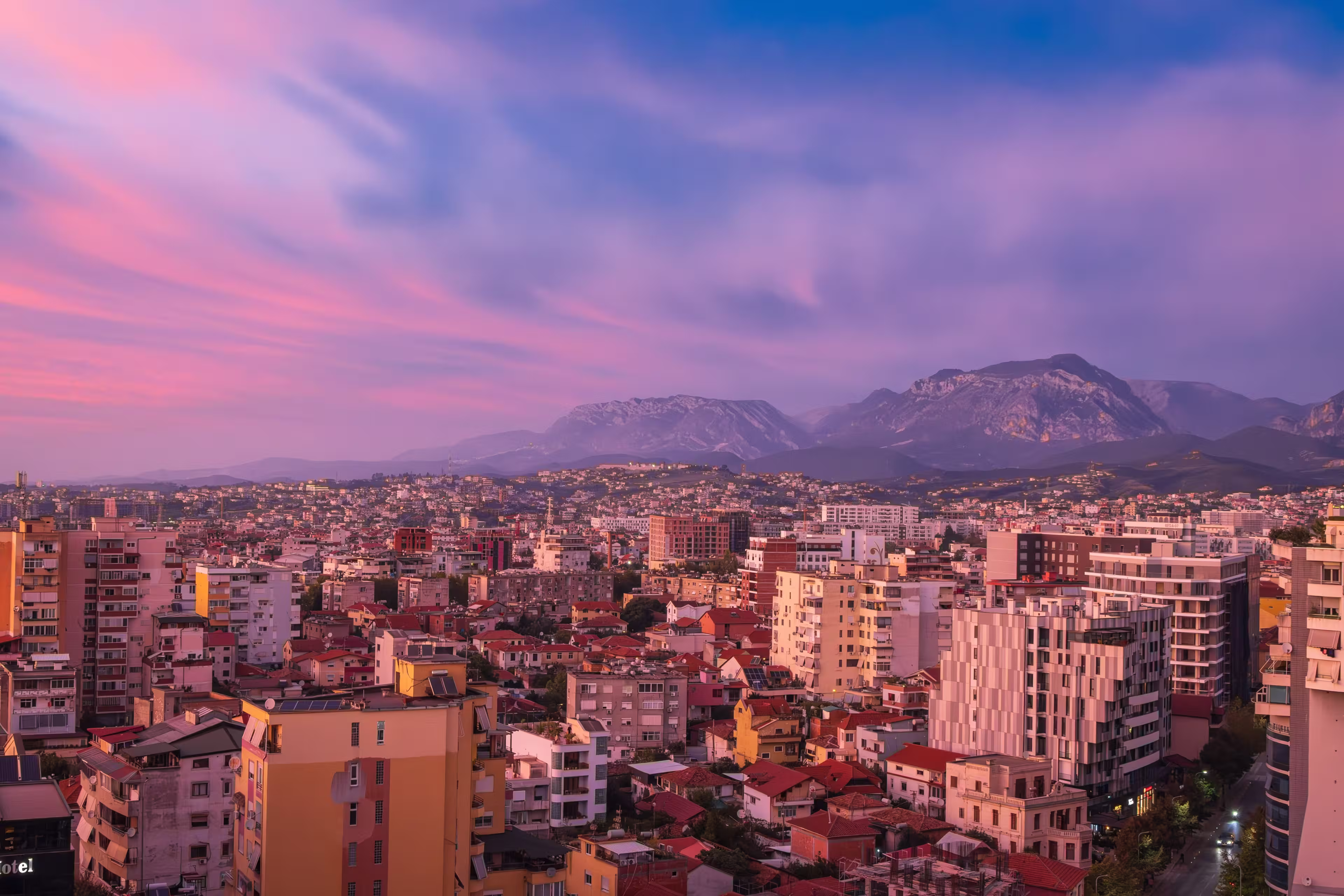 Tirana, Albania. Modern cityscape of downtown Tirana in pink sunset light.
