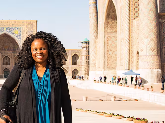 KFPU - Pax smiling in front of Registan Square in Samarkand, Uzbekistan
