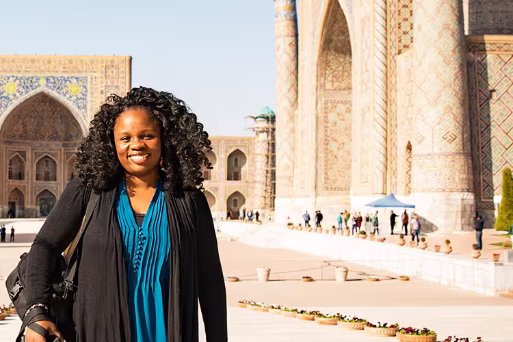 KFPU - Pax smiling in front of Registan Square in Samarkand, Uzbekistan