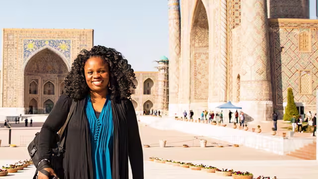 KFPU - Pax smiling in front of Registan Square in Samarkand, Uzbekistan