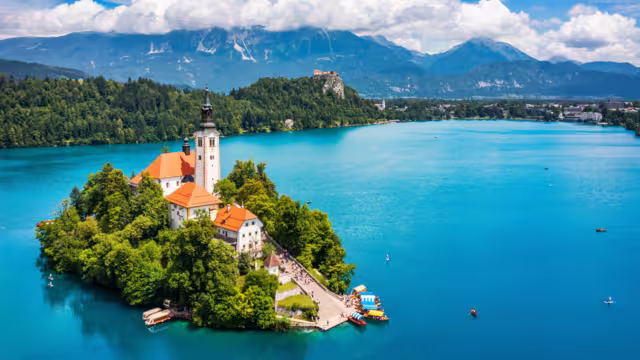 Lake Bled in Slovenia. Beautiful mountains and Bled lake with small Pilgrimage Church. Bled lake and island with Pilgrimage Church of the Assumption of Maria. Bled, Slovenia, Europe.