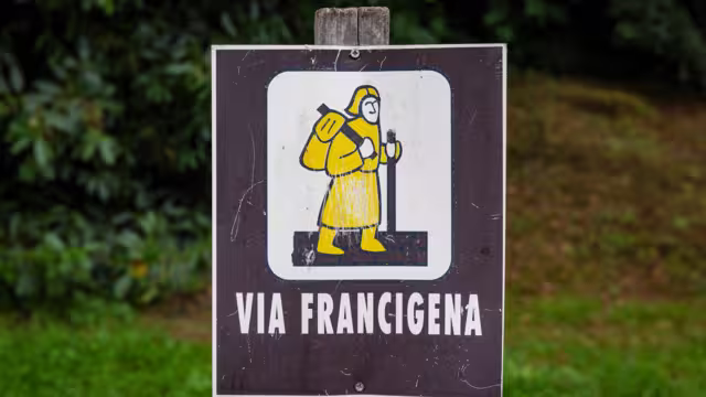 signpost of the Via Francigena (pilgrim's route to Rome) in the countryside