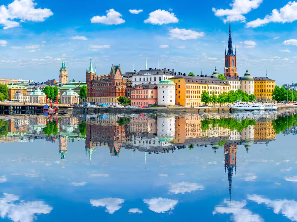 Old town (Gamla Stan) architecture reflected in sea, Stockholm, Sweden