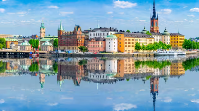 Old town (Gamla Stan) architecture reflected in sea, Stockholm, Sweden