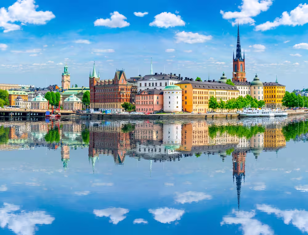 Old town (Gamla Stan) architecture reflected in sea, Stockholm, Sweden