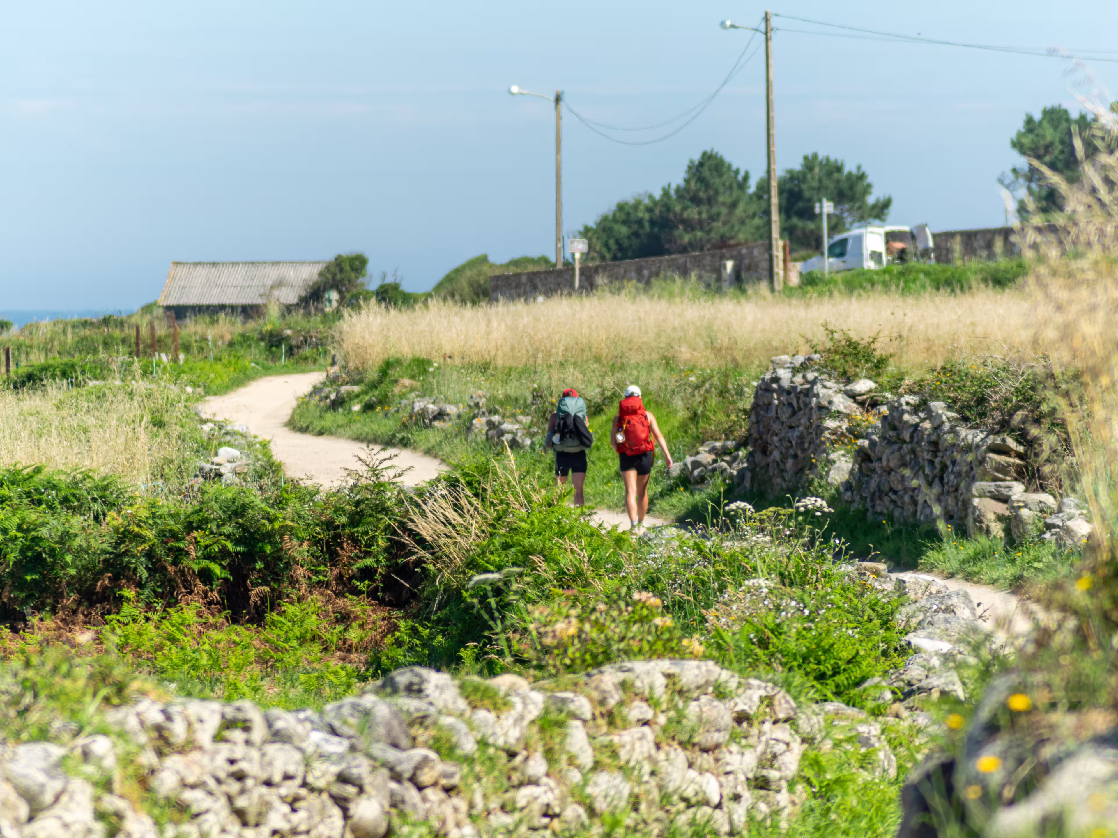 two pilgrims making the Way of St. James along the coast from Portugal