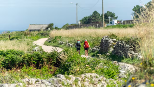 two pilgrims making the Way of St. James along the coast from Portugal