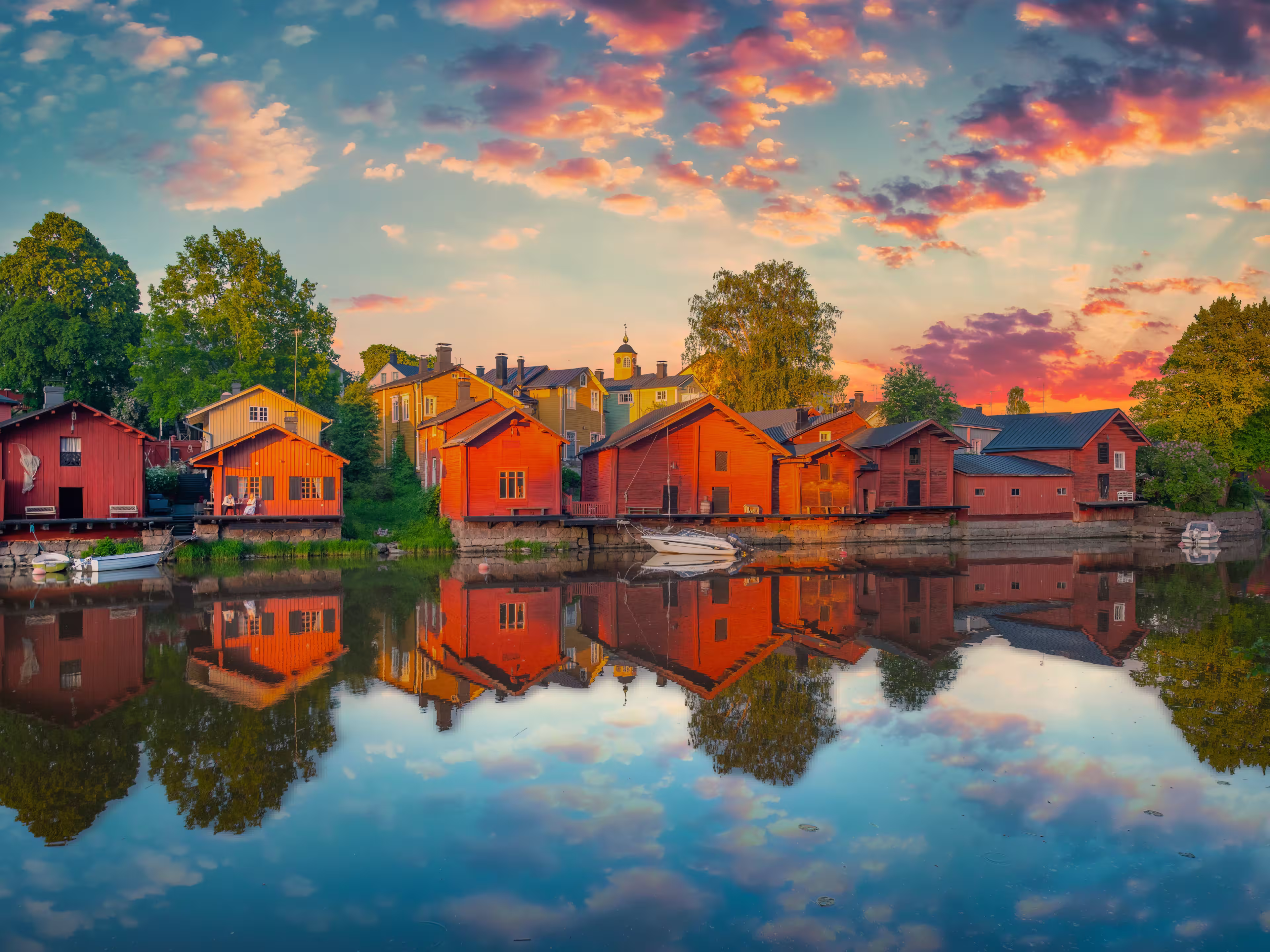 Classic old wood houses and their reflection in river, Porvoo Finland