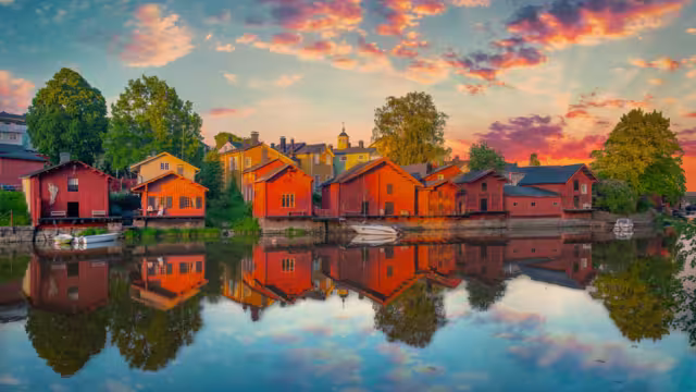 Classic old wood houses and their reflection in river, Porvoo Finland