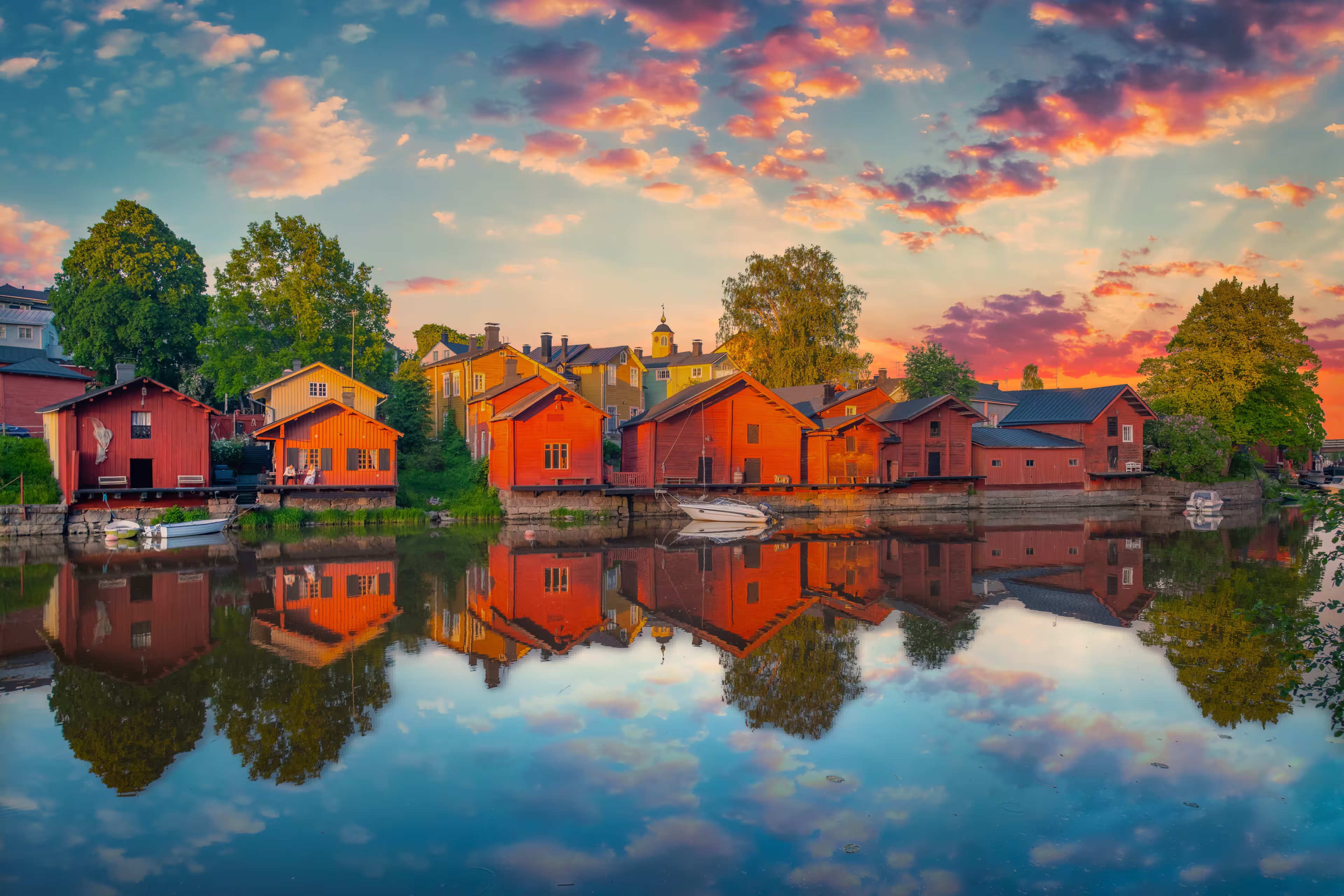 Classic old wood houses and their reflection in river, Porvoo Finland