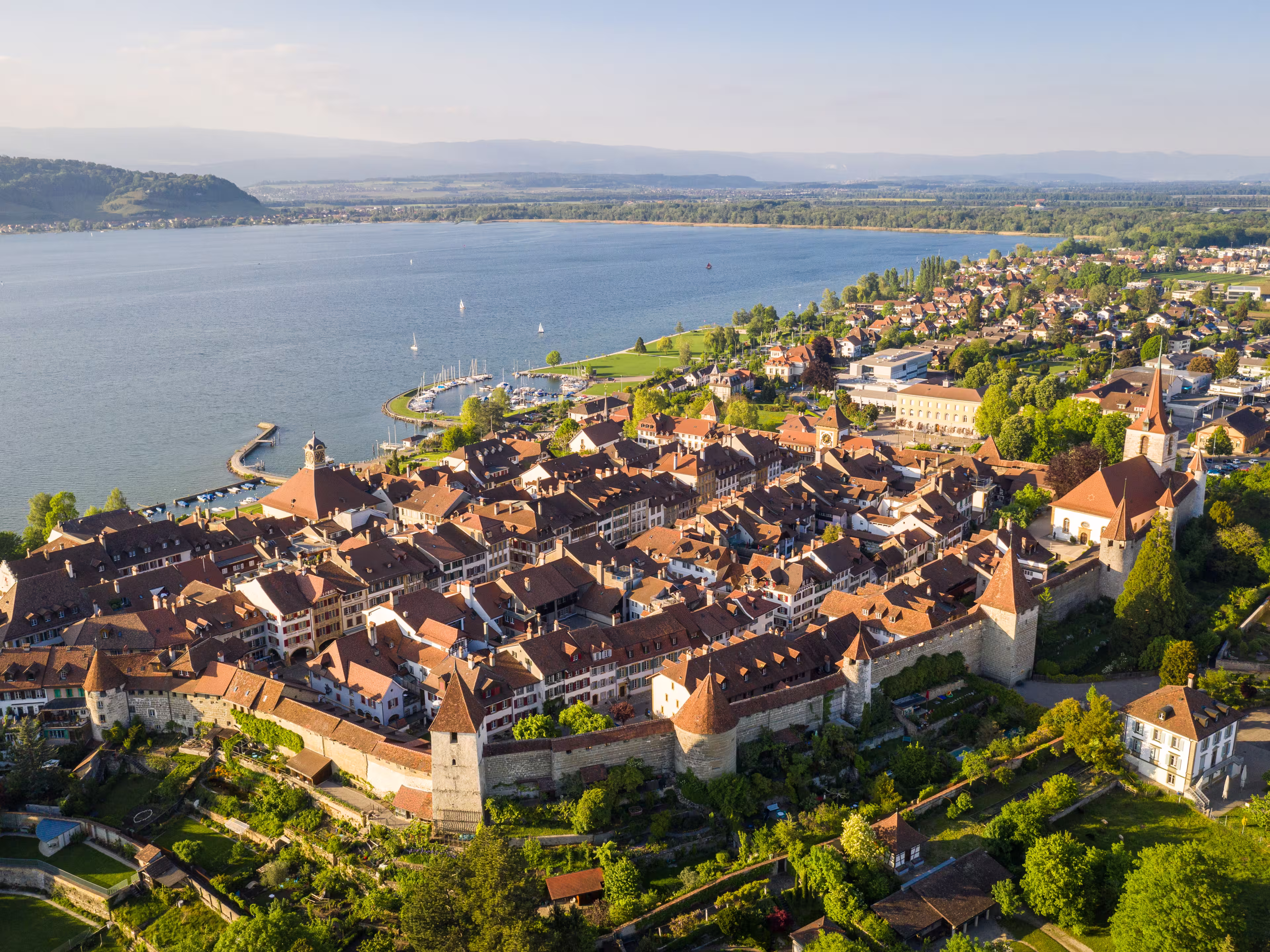 Aerial view of the famous medieval Morat, or Murten in German, old town by lake Morat in canton Fribourg in Switzerland