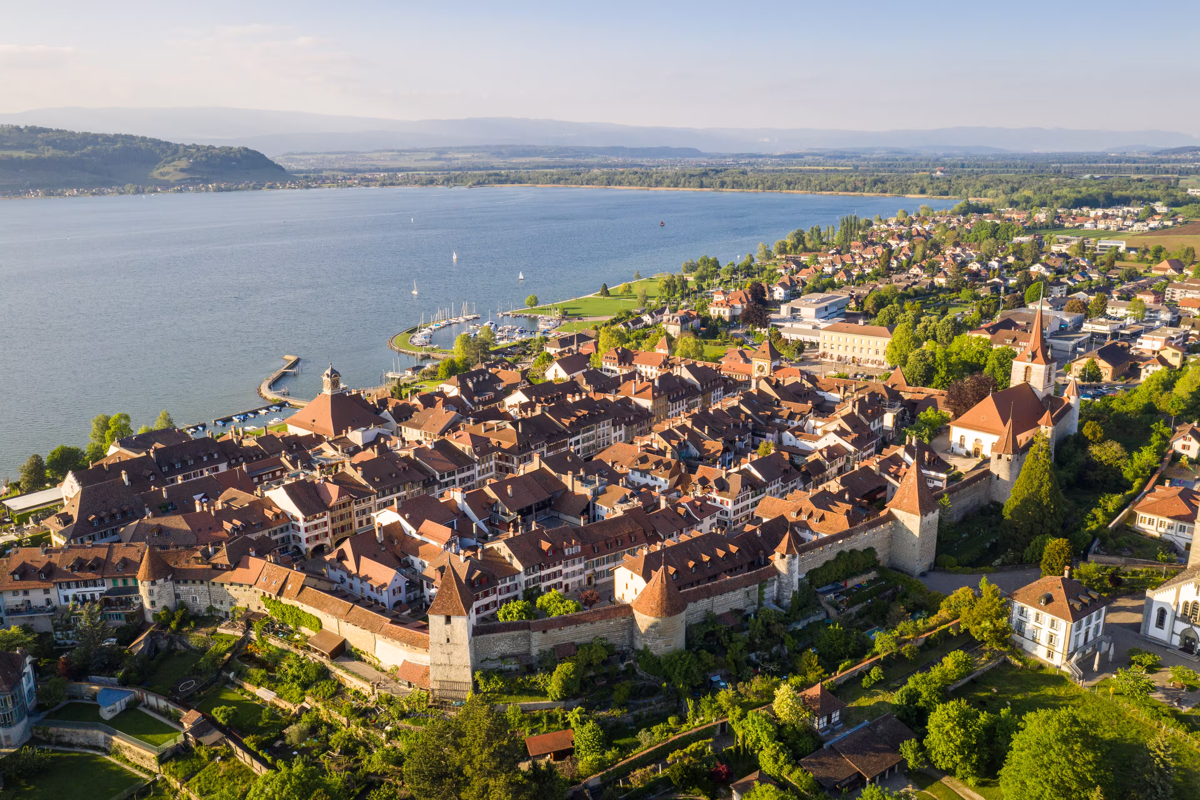 Aerial view of the famous medieval Morat, or Murten in German, old town by lake Morat in canton Fribourg in Switzerland