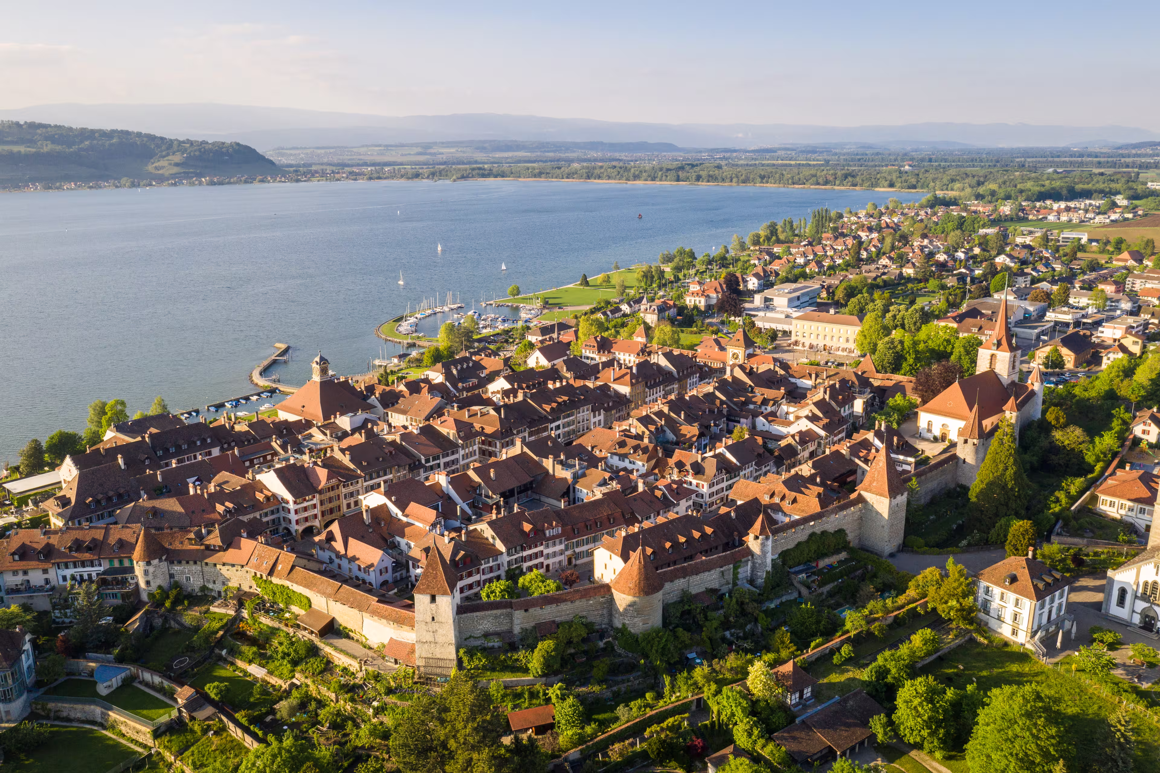 Aerial view of the famous medieval Morat, or Murten in German, old town by lake Morat in canton Fribourg in Switzerland