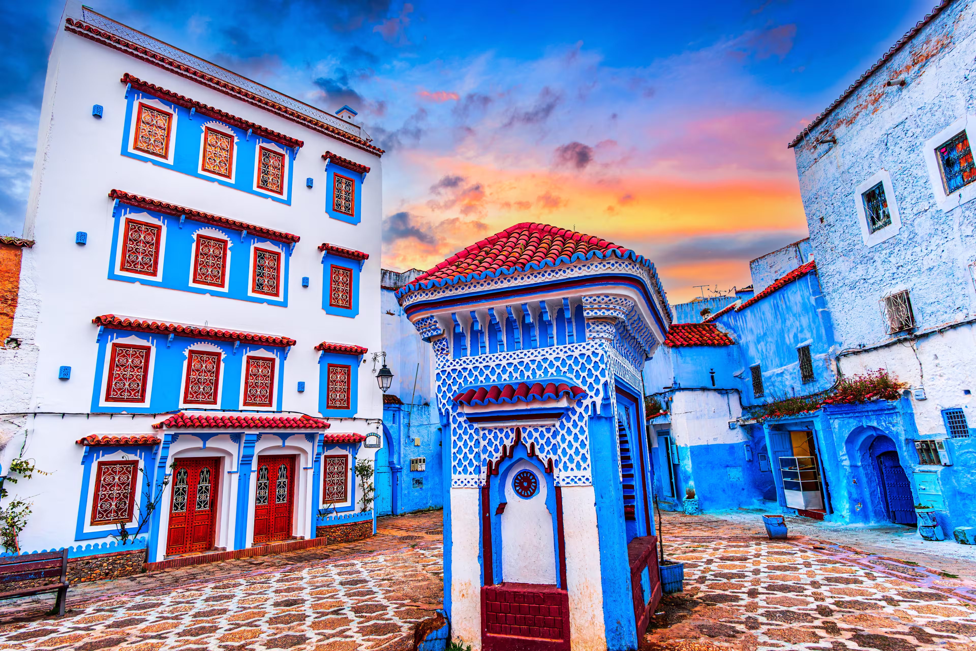 Chefchaouen, Morocco: Blue narow stairs with colourful walls and flowerpots into old walled city, or medina, North Africa