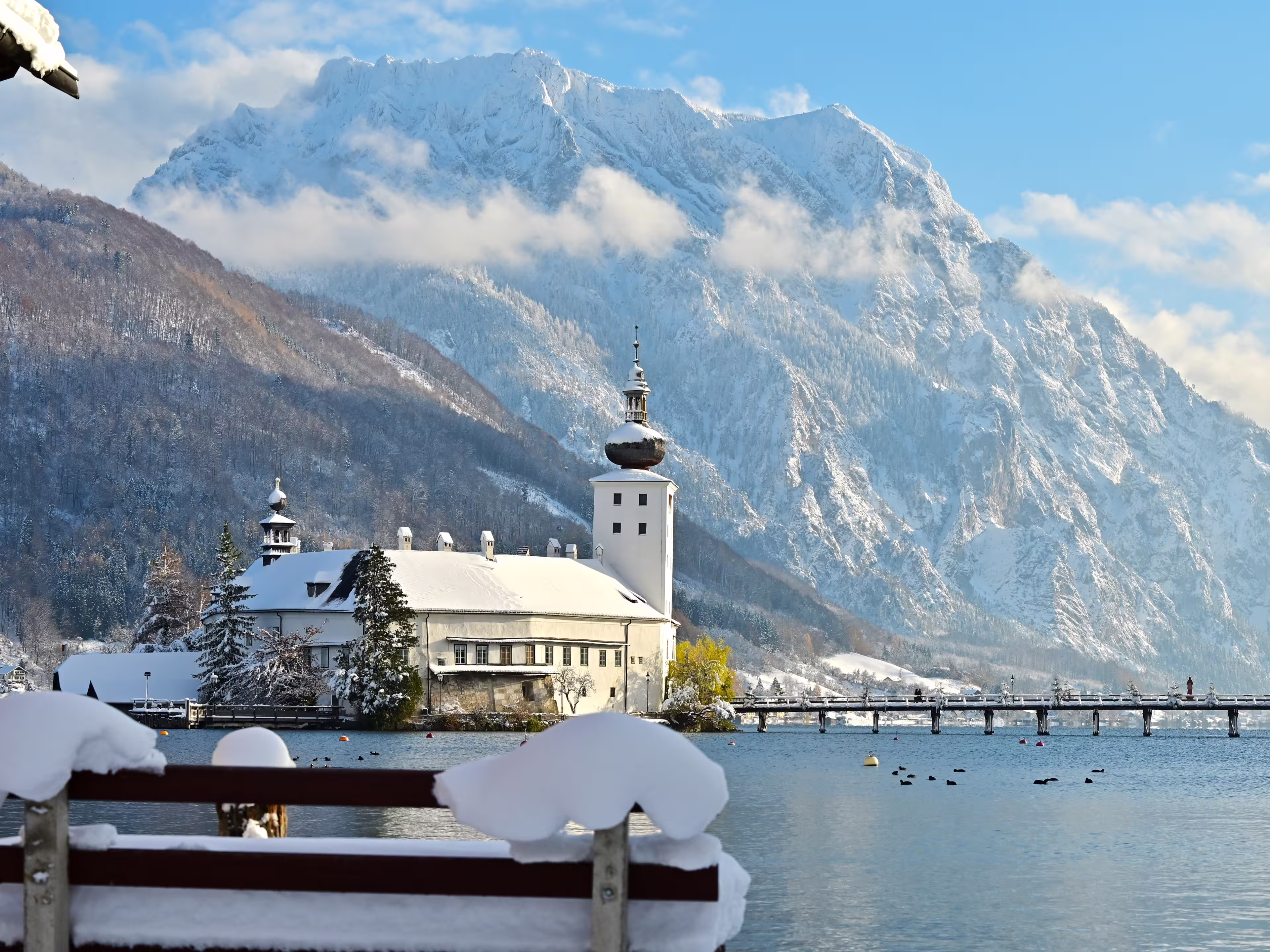 The Ort lake castle on an island on Lake Traunsee in Gmunden in winter with snow