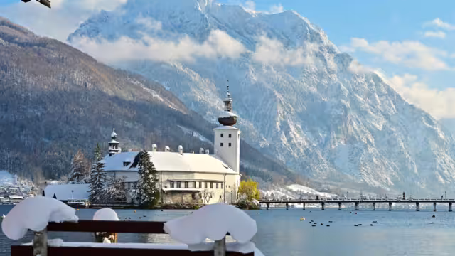 The Ort lake castle on an island on Lake Traunsee in Gmunden in winter with snow
