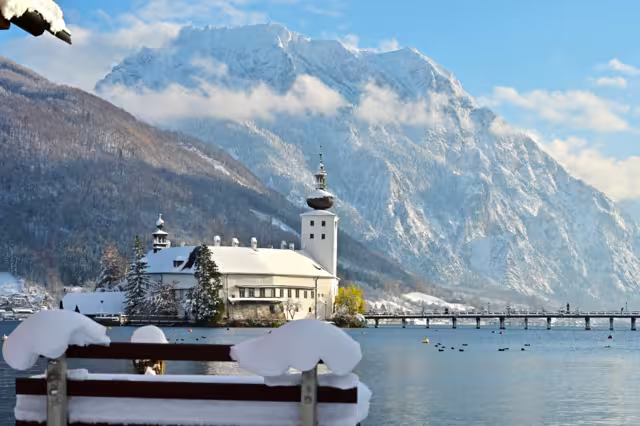 The Ort lake castle on an island on Lake Traunsee in Gmunden in winter with snow