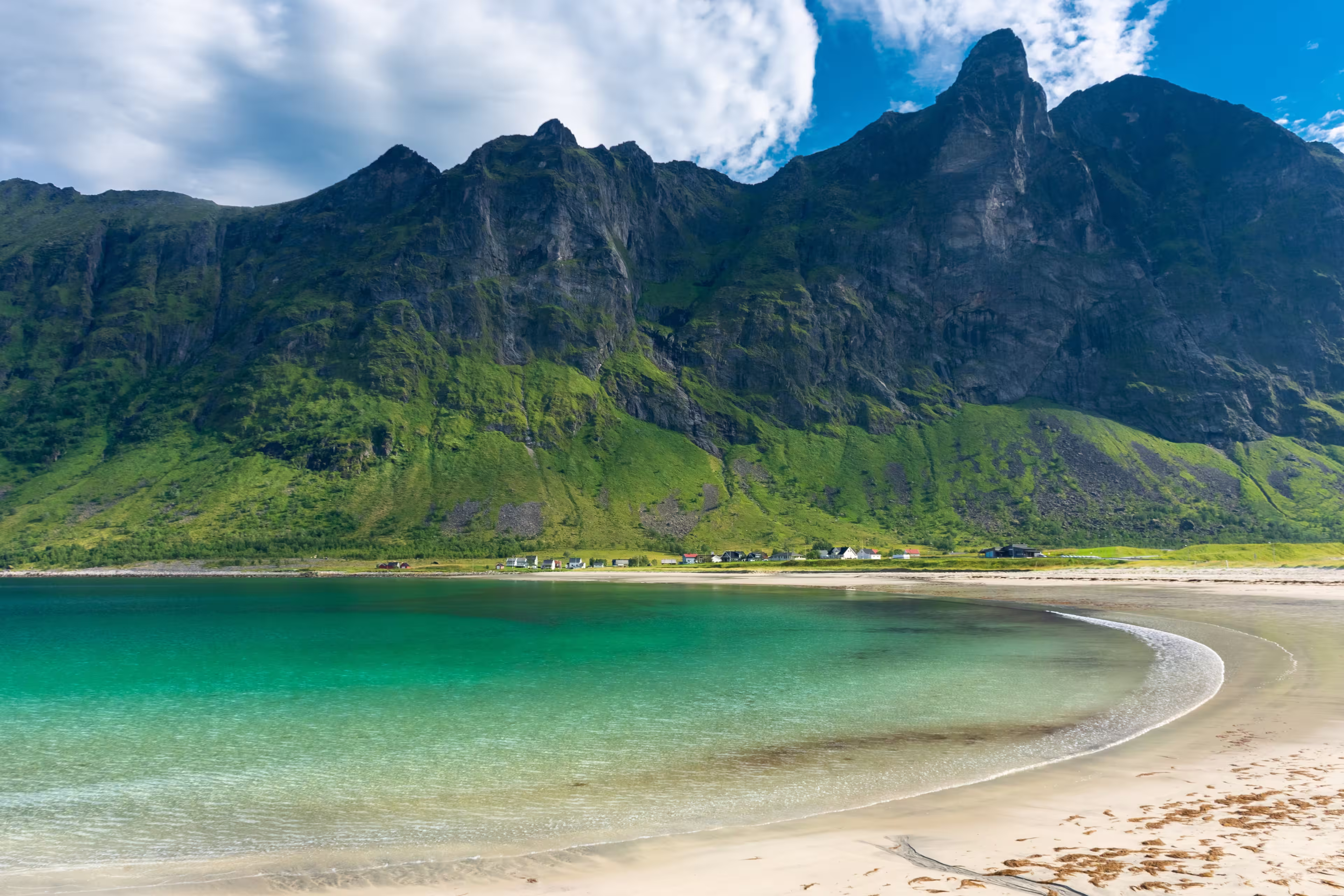 The crystal clear water of the Ersfjordstranda beach in Senja Island, Norway