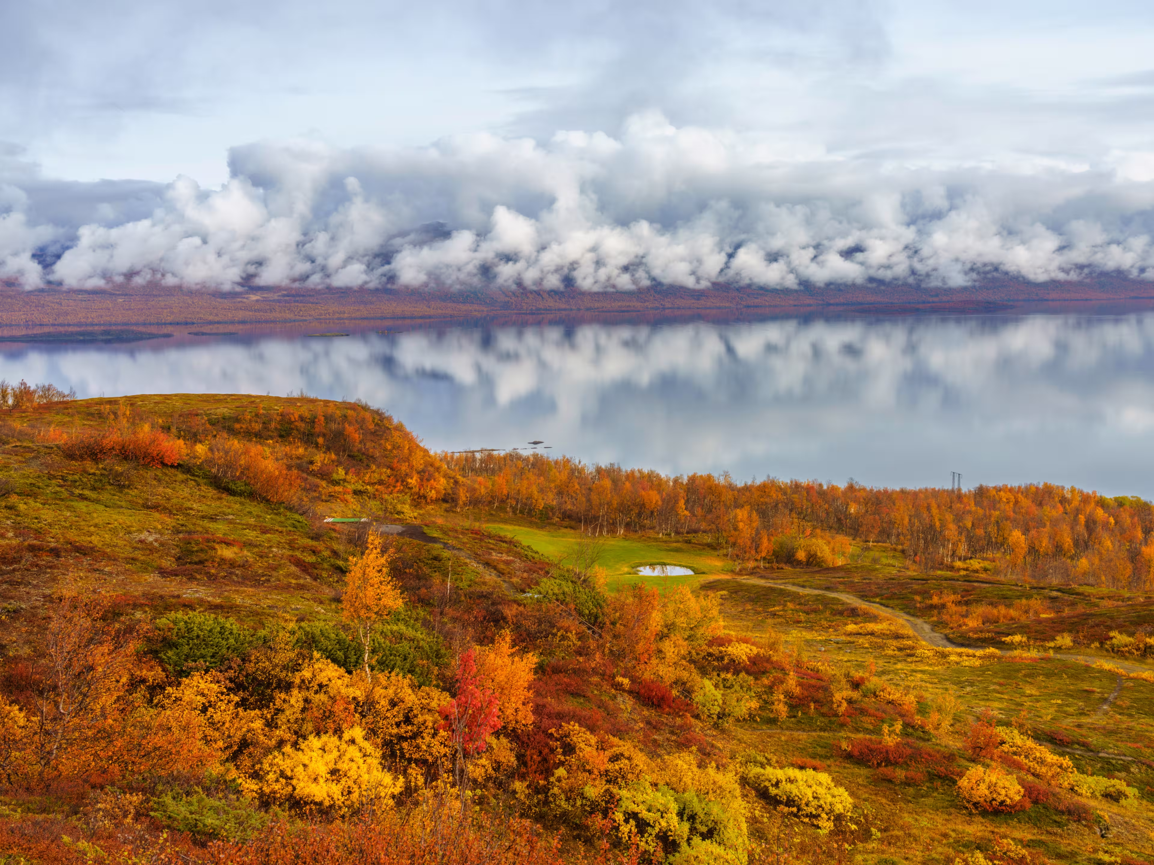 Autumn season in Abisko with Lapporten in background, and Björkliden golf course in foreground, taken from Björkliden, Swedish Lapland, Sweden
