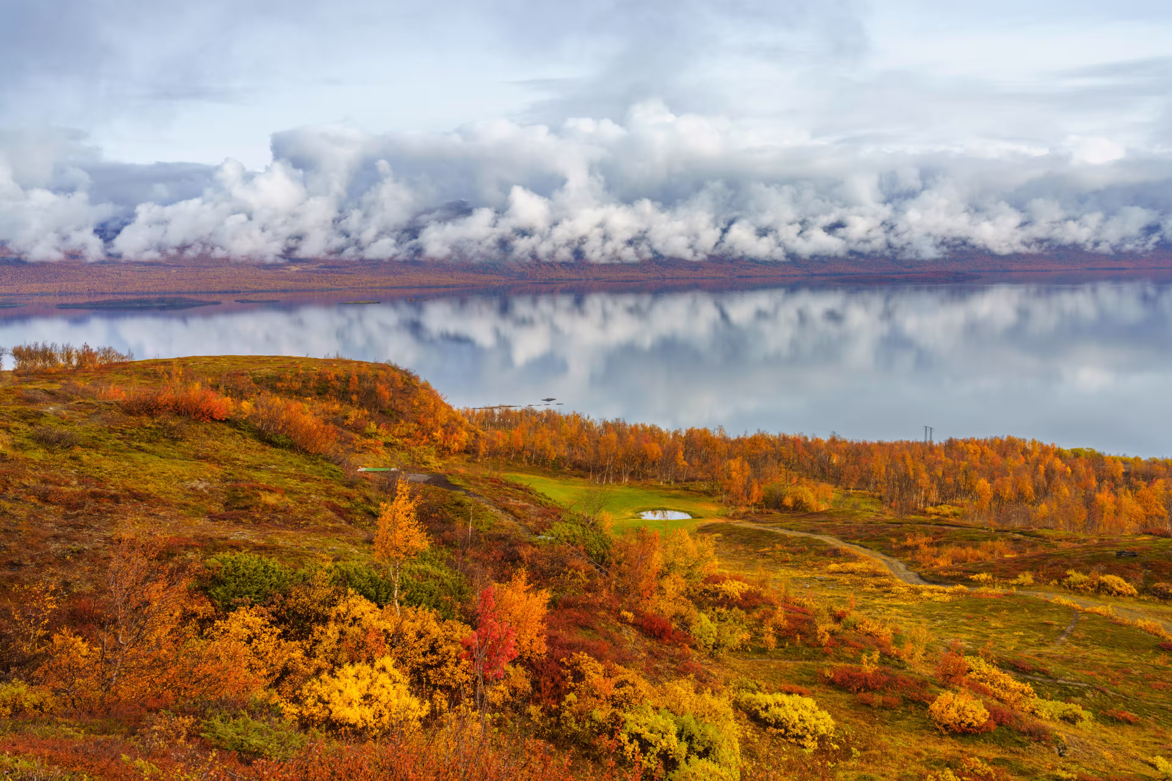 Autumn season in Abisko with Lapporten in background, and Björkliden golf course in foreground, taken from Björkliden, Swedish Lapland, Sweden