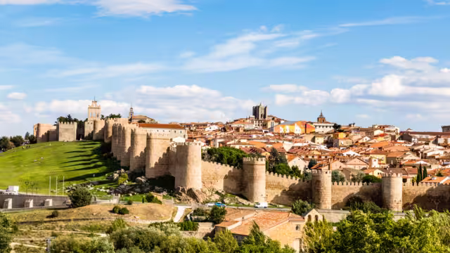 Panoramic view of the historic city of Avila from the Mirador of Cuatro Postes, Spain, with its famous medieval town walls. UNESCO World Heritage. Called the Town of Stones and Saints