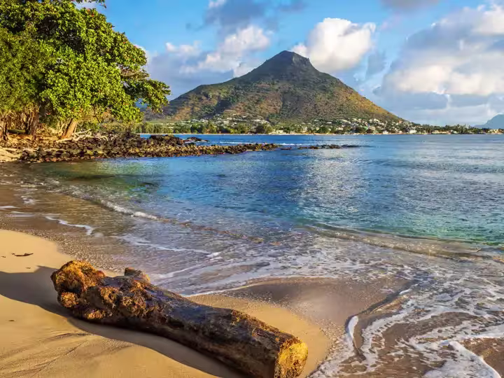 Rocky and sandy shore in Tamarin Bay, Wolmar, Flic en Flac, Mauritius Island, Indian Ocean
