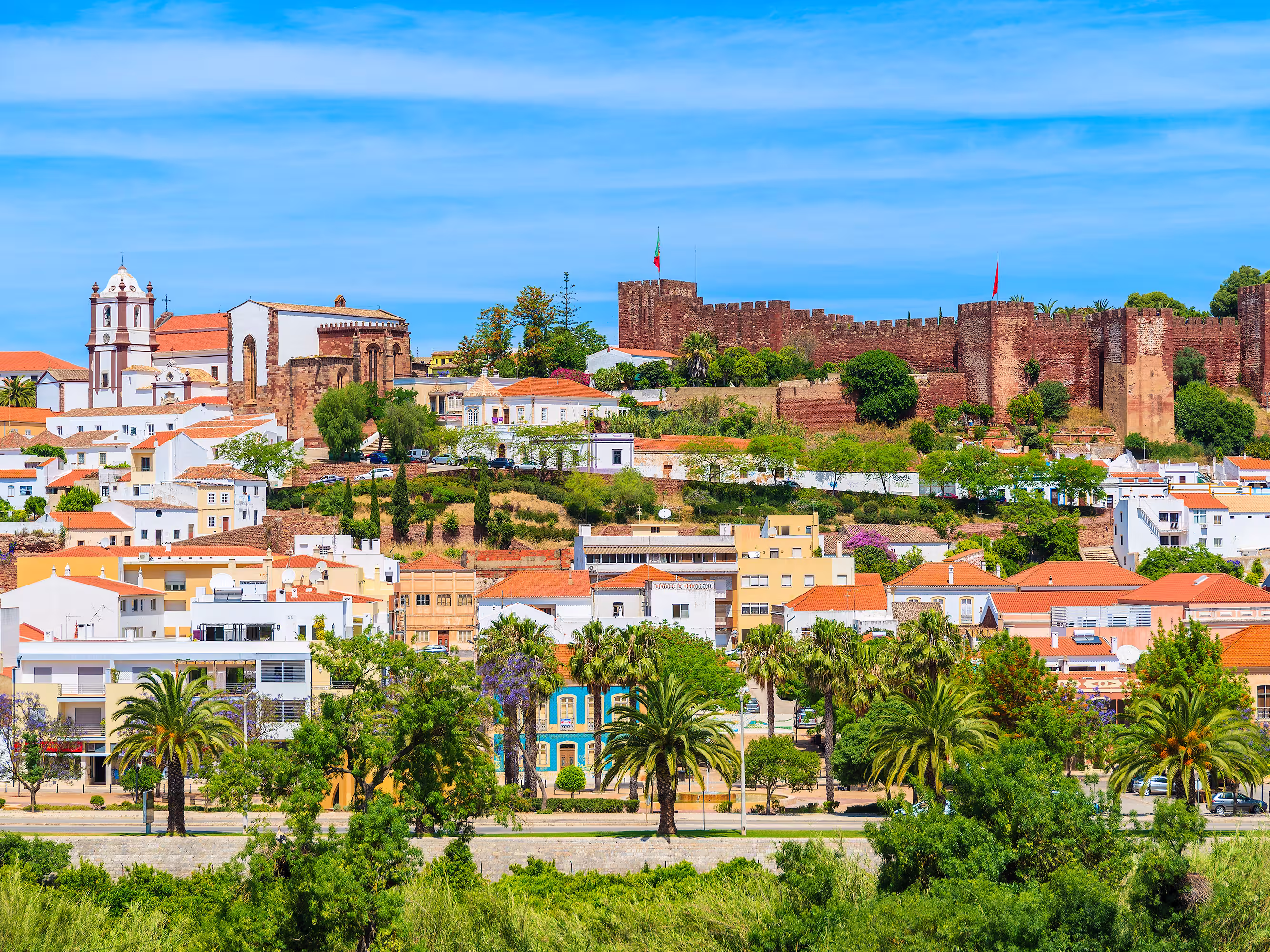 View of Silves town buildings with famous castle and cathedral, Algarve region, Portugal