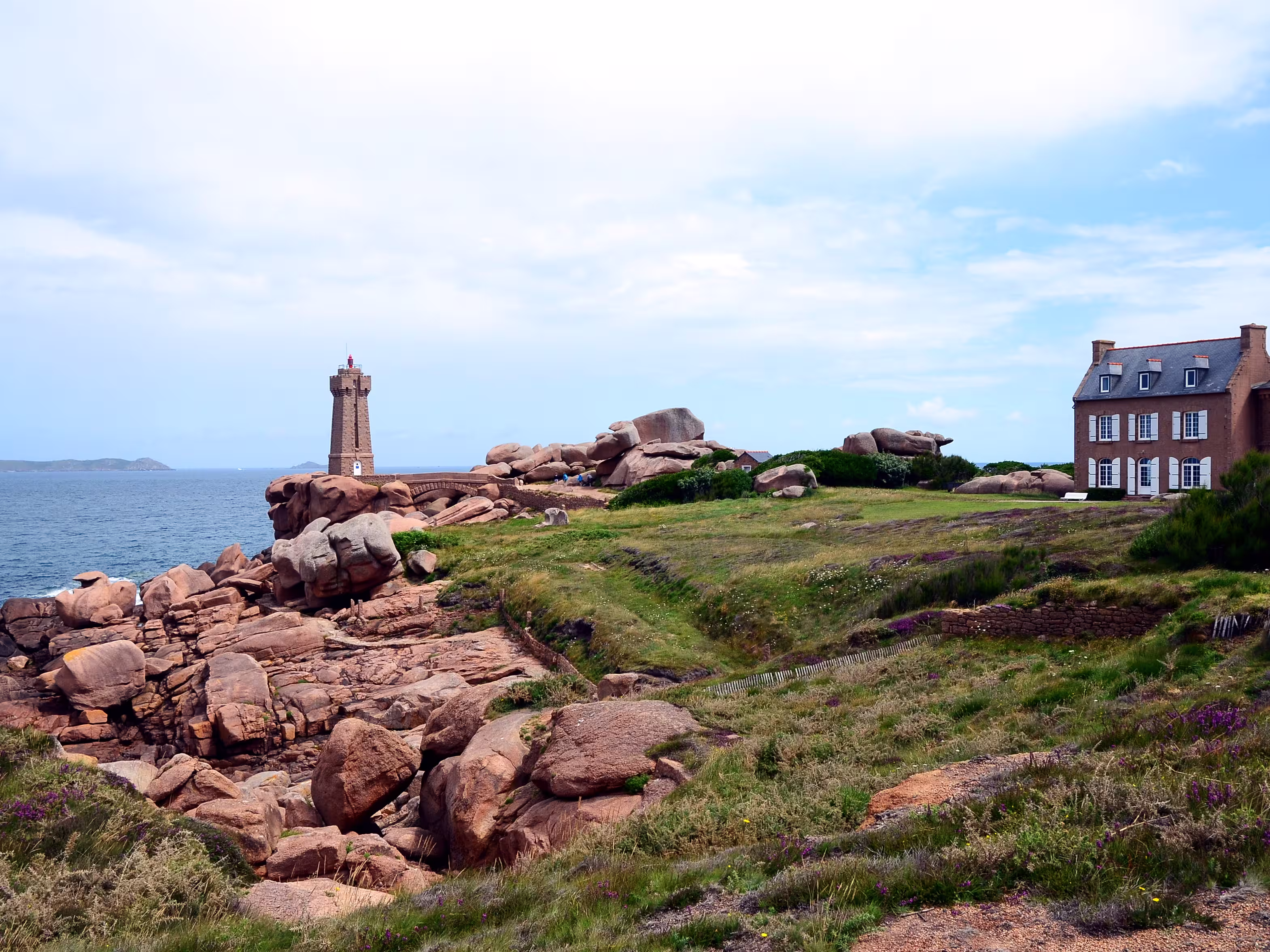 View at the The Ploumanac'h Lighthouse (officially the Mean Ruz Lighthouse) situated at the Pink Granite Coast or Cote de Granite Rose in Brittany, France