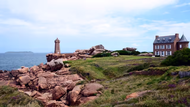 View at the The Ploumanac'h Lighthouse (officially the Mean Ruz Lighthouse) situated at the Pink Granite Coast or Cote de Granite Rose in Brittany, France