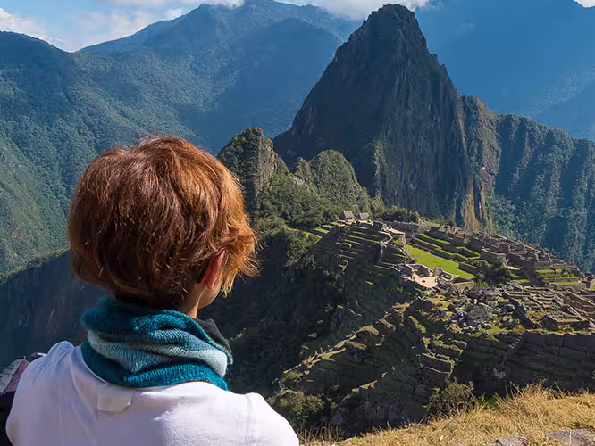 GGPIC - Woman admiring Machu Picchu from a distance