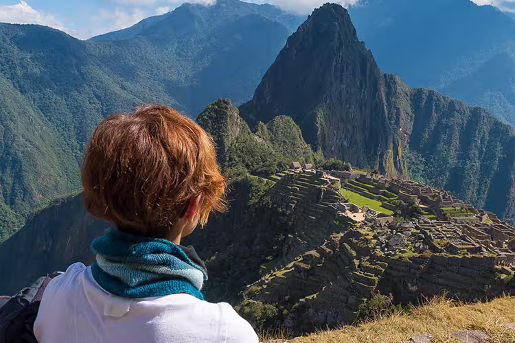 GGPIC - Woman admiring Machu Picchu from a distance