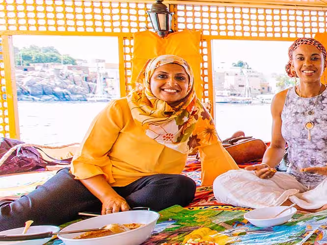 group of travellers enjoying a Felucca lunch on the Nile, Egypt