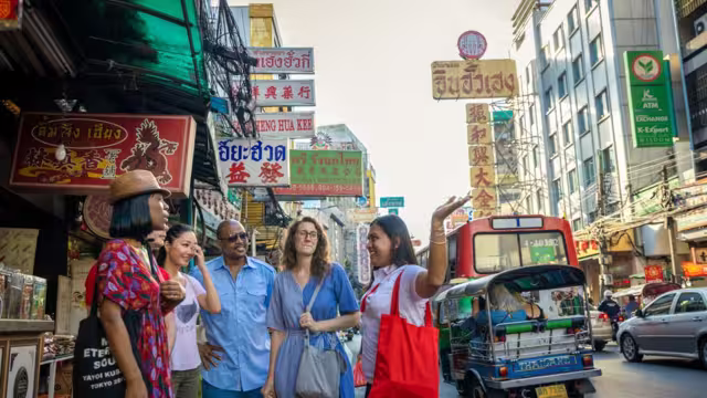Group of travellers exploring Chinatown in Bangkok, Thailand