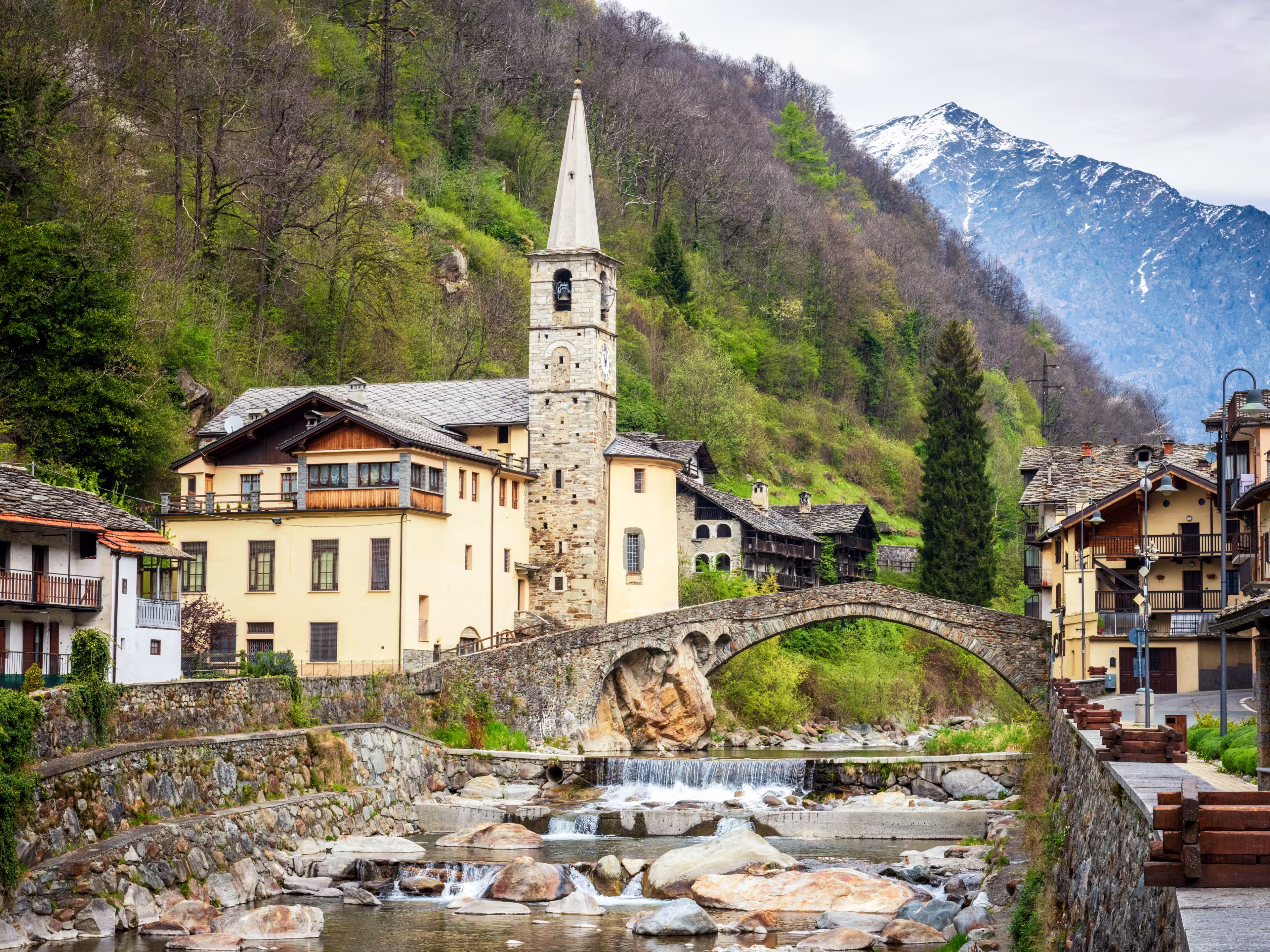 Fontainemore alpine village on the Lys river in a forest in the valley of Gressoney near Monte Rosa during spring. Aosta Valley, Aosta, Italy.