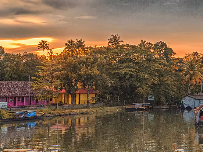 HHPWC - Sunset views of the Kerala Backwaters surrounded by palm trees