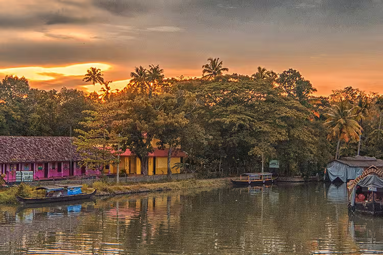 HHPWC - Sunset views of the Kerala Backwaters surrounded by palm trees