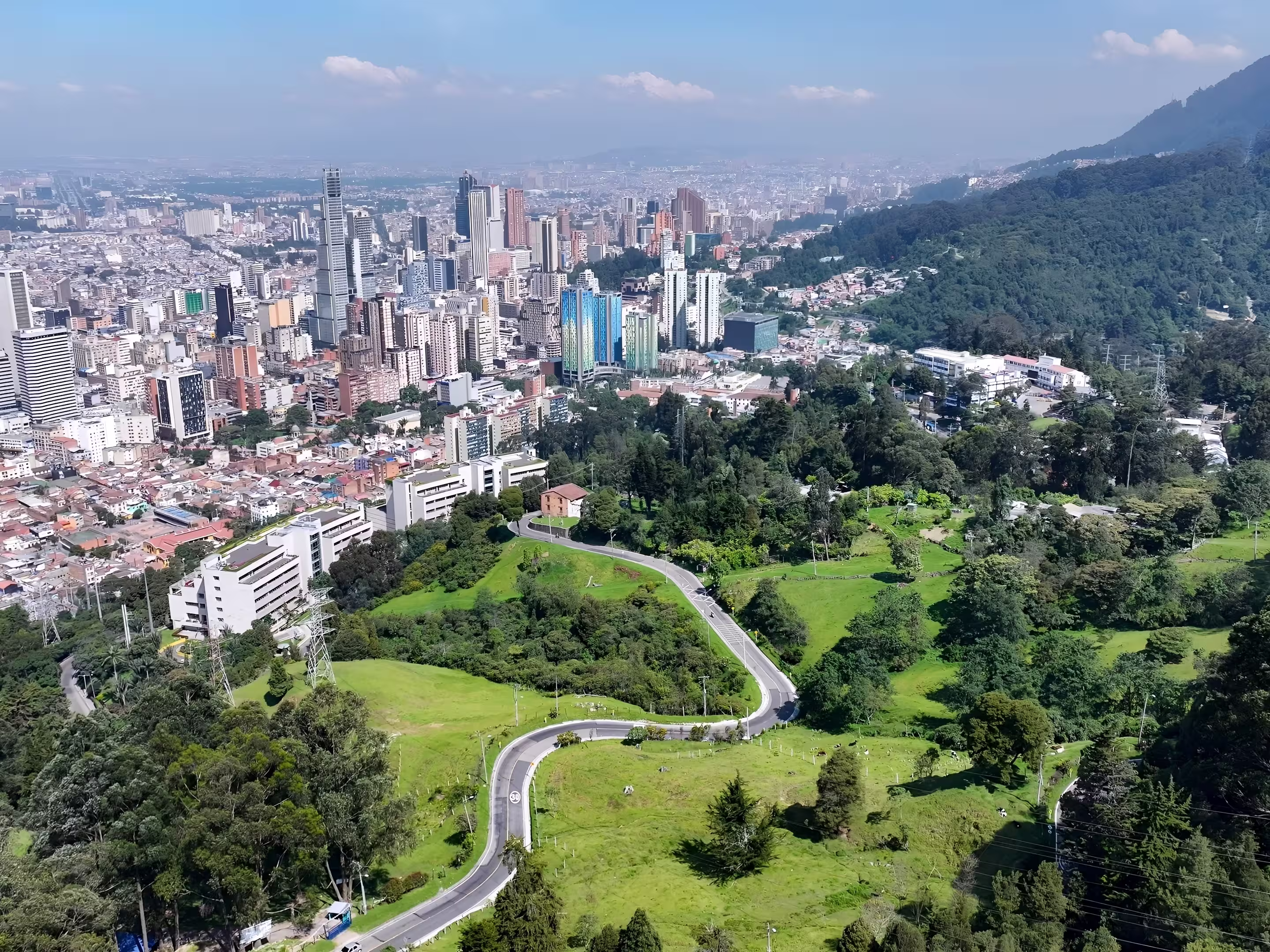 Bogota Skyline In Bogota District Capital Colombia. Aerial View Of A High-Rise Buildings And Traffic Showcasing Urban Life. Business Sky Background Downtown Cityscape. Business Panning Wide.