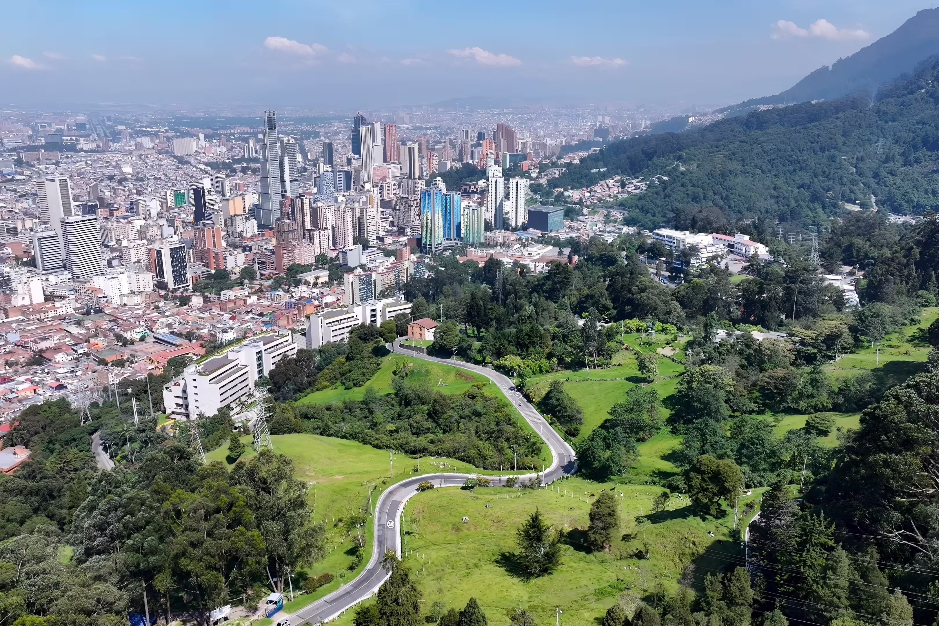 Bogota Skyline In Bogota District Capital Colombia. Aerial View Of A High-Rise Buildings And Traffic Showcasing Urban Life. Business Sky Background Downtown Cityscape. Business Panning Wide.
