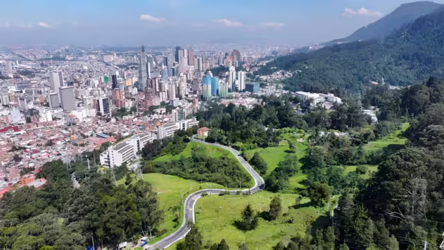 Bogota Skyline In Bogota District Capital Colombia. Aerial View Of A High-Rise Buildings And Traffic Showcasing Urban Life. Business Sky Background Downtown Cityscape. Business Panning Wide.
