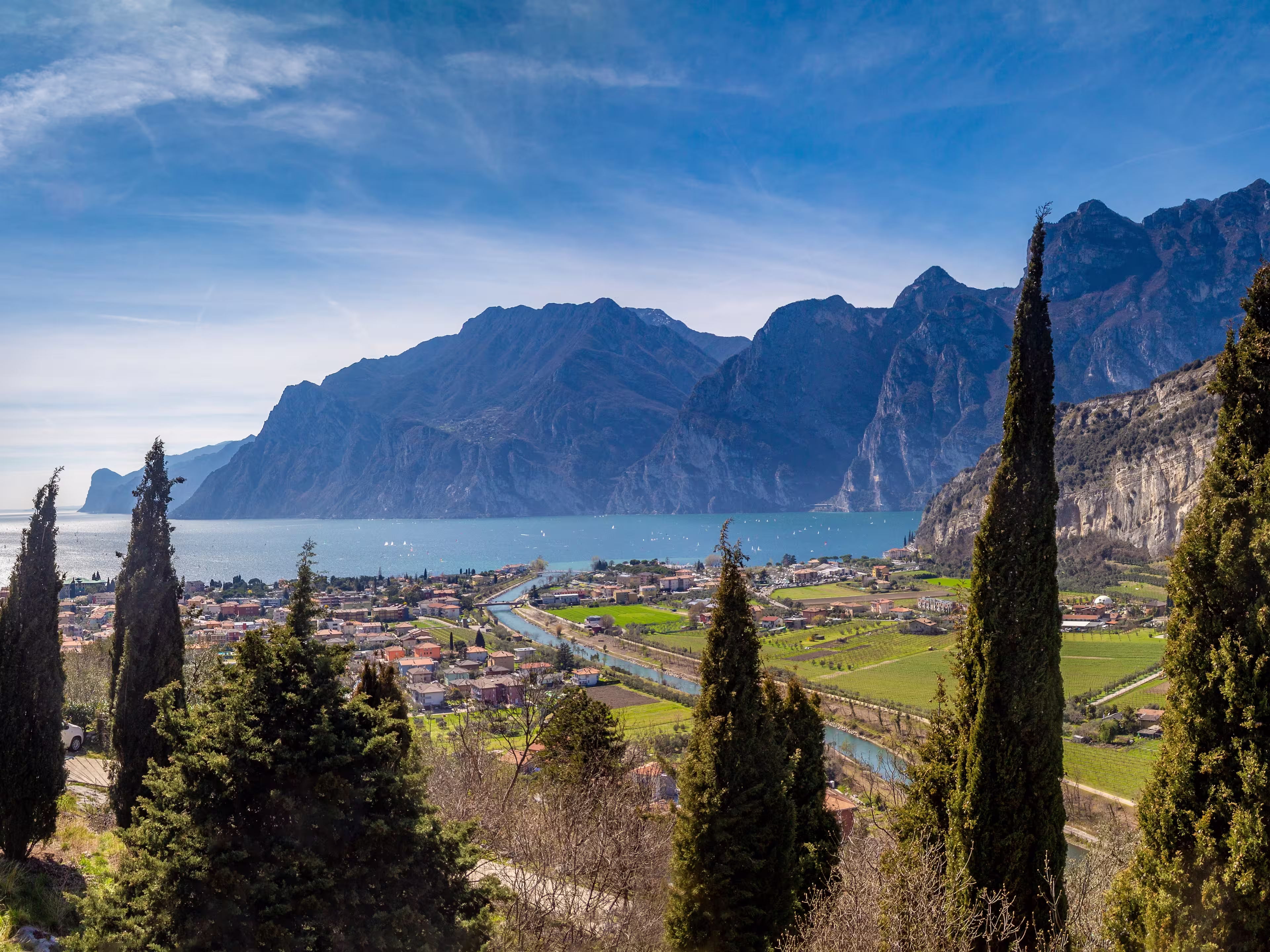 Panorama of the gorgeous Lake Garda surrounded by mountains in Riva del Garda, Italy