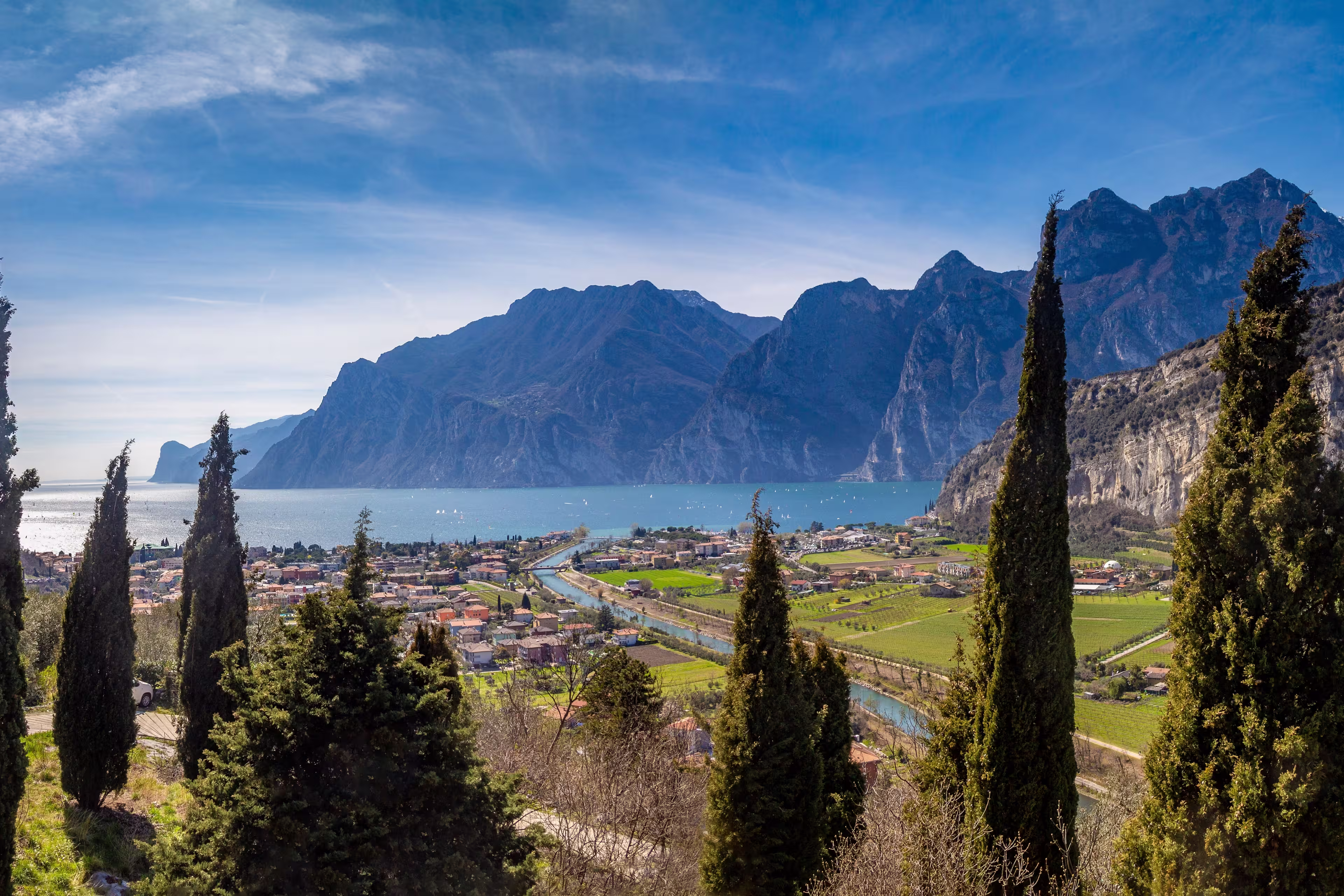 Panorama of the gorgeous Lake Garda surrounded by mountains in Riva del Garda, Italy