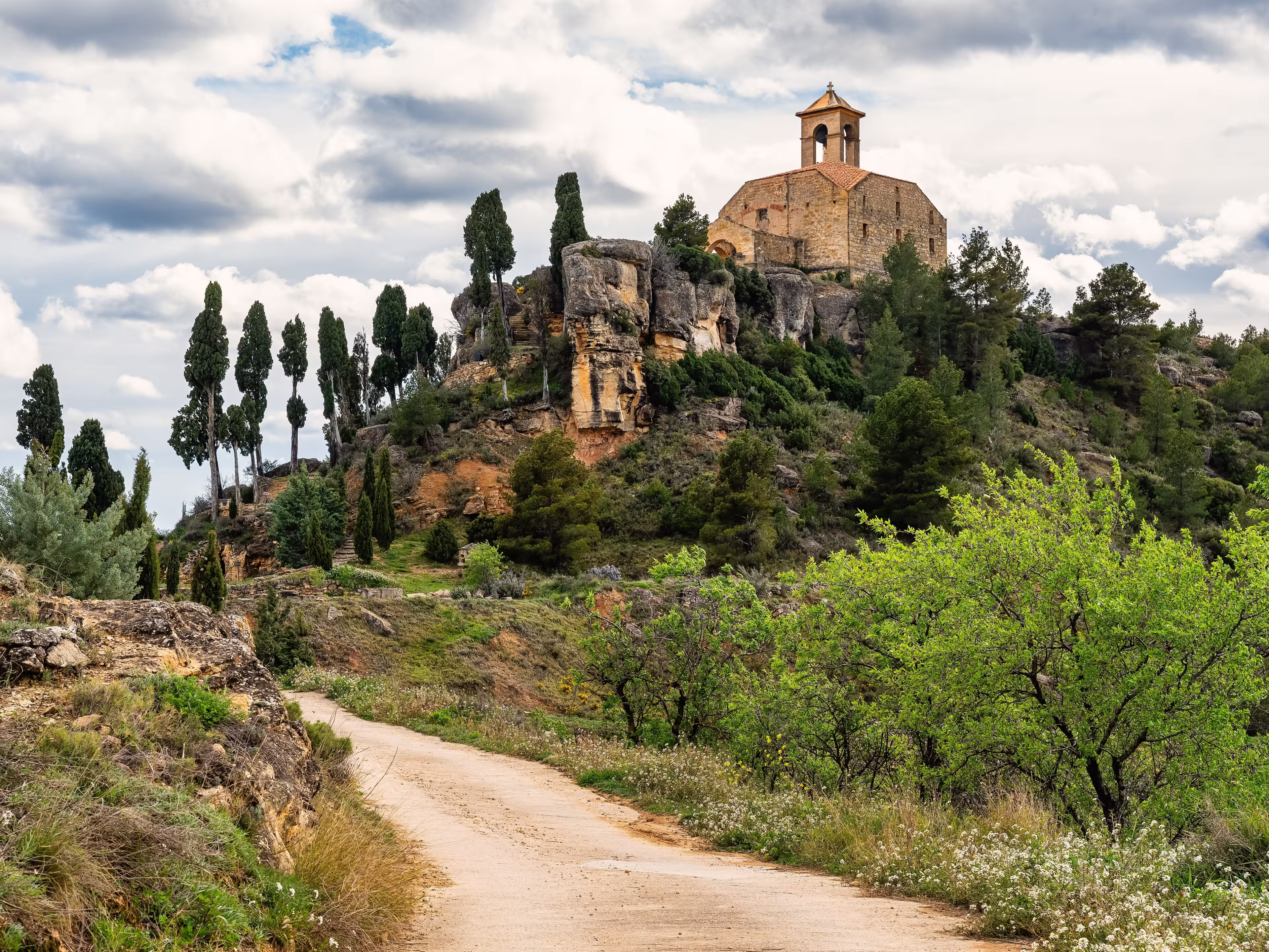 Catholic hermitage on top of a hill next to the mountains of the village of La Fresneda, Teruel