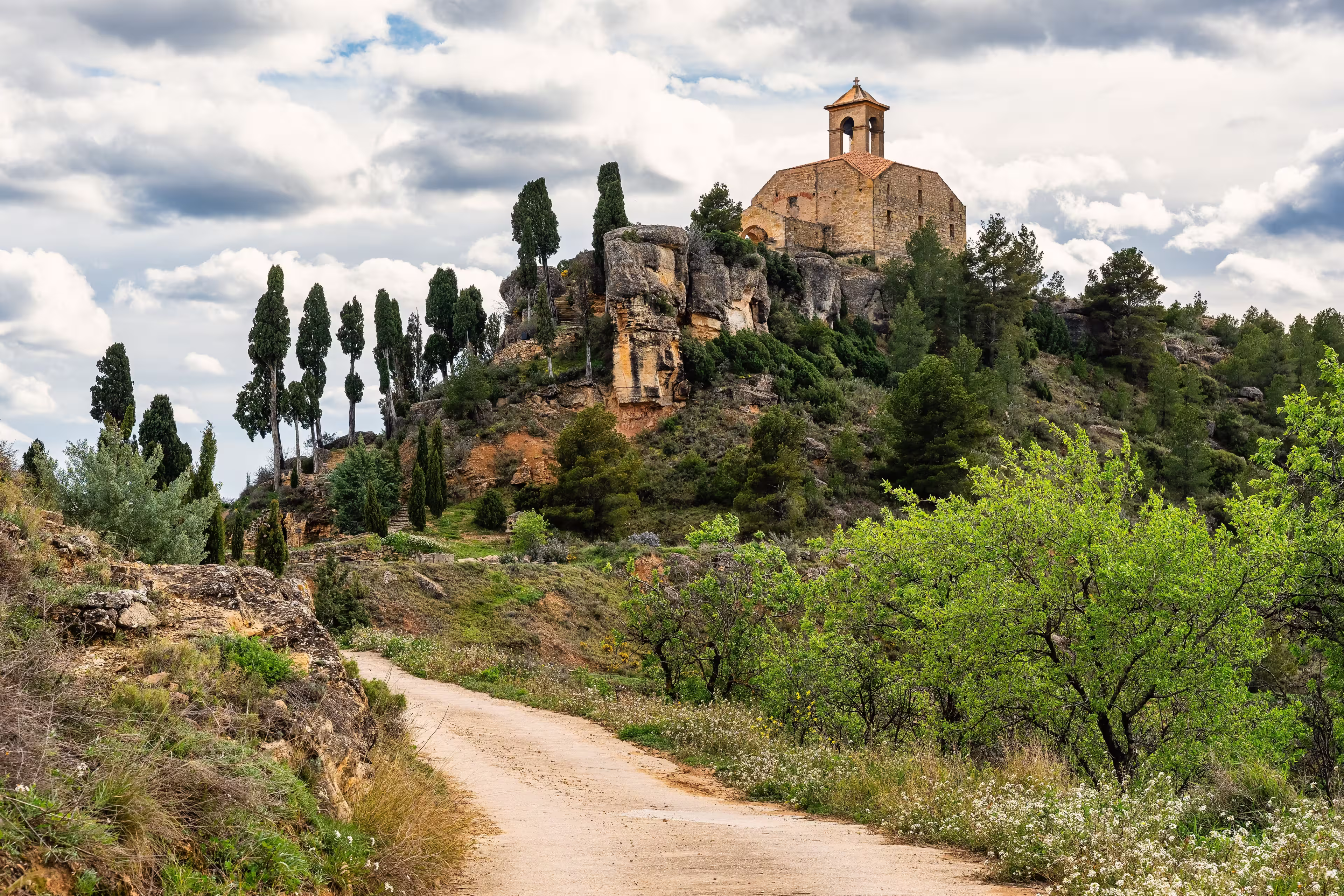 Catholic hermitage on top of a hill next to the mountains of the village of La Fresneda, Teruel