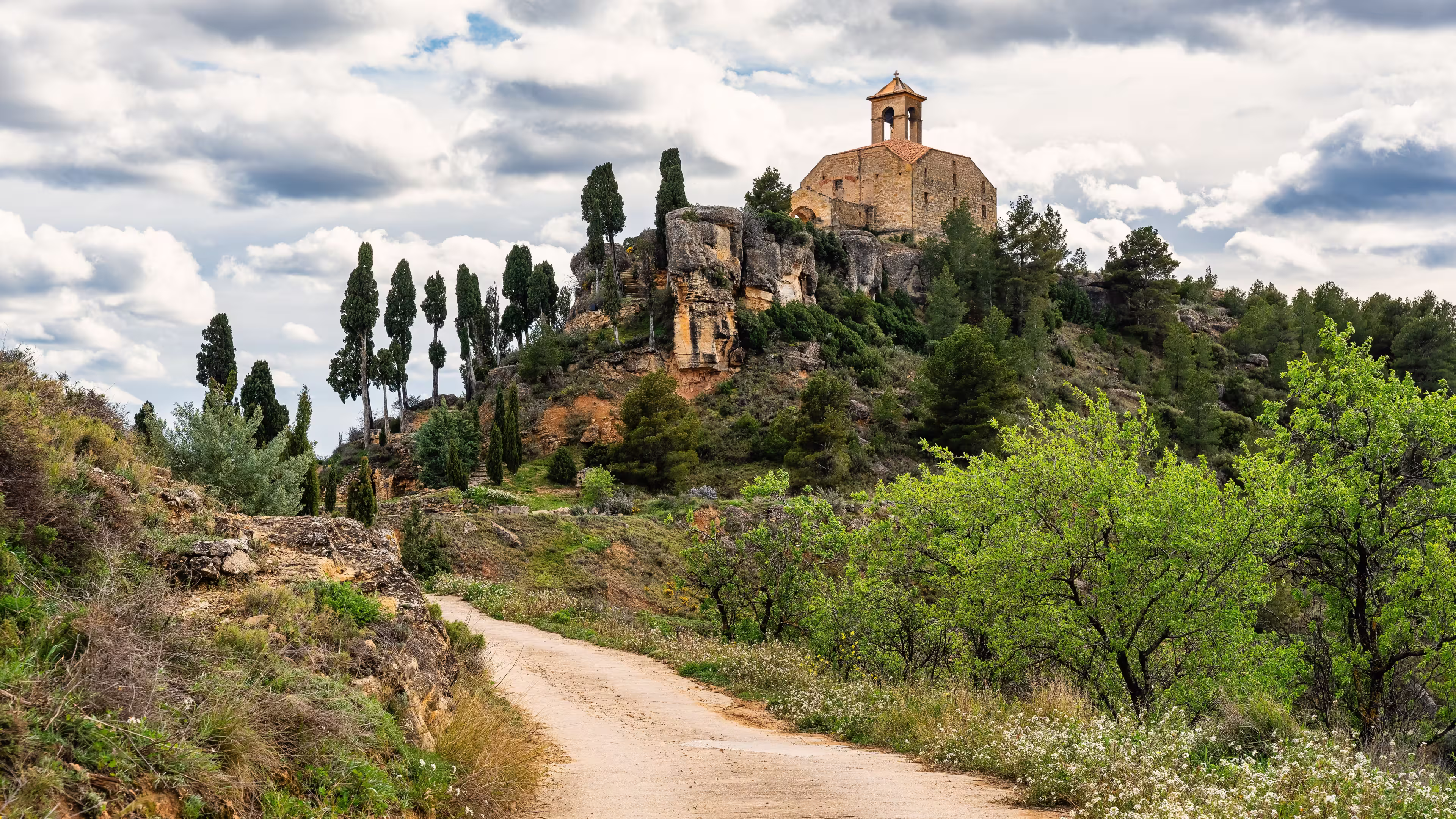 Catholic hermitage on top of a hill next to the mountains of the village of La Fresneda, Teruel