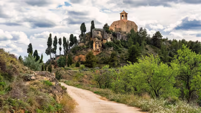 Catholic hermitage on top of a hill next to the mountains of the village of La Fresneda, Teruel